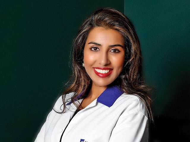 Dr Chytra V Anand, the only female member of the Karnataka Medical Council, smiling and standing confidently.