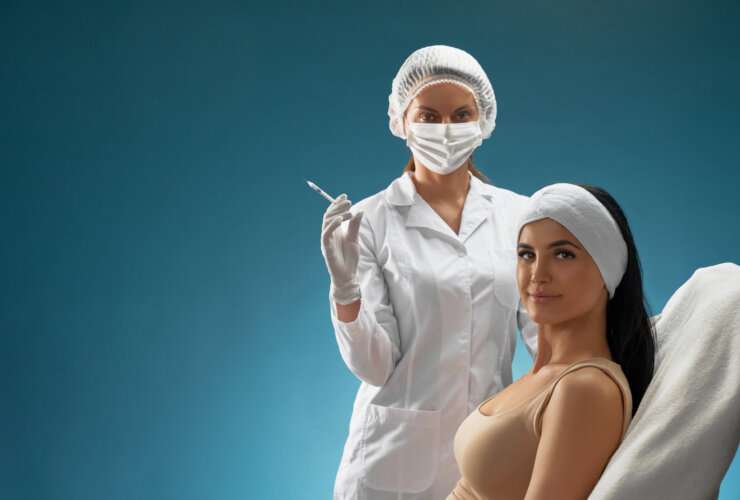 A cosmetologist with a syringe treating a patient in a chair, representing the booming cosmetic surgery market.