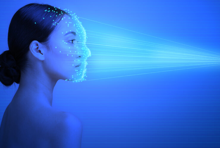 A digital illustration of AI technology in skin cancer detection, featuring a face with a grid overlay and highlighted areas representing data analysis.