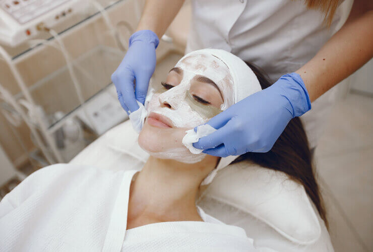 A woman receiving a cosmetic treatment at a cosmetology studio, showcasing some of the hottest aesthetic treatments.