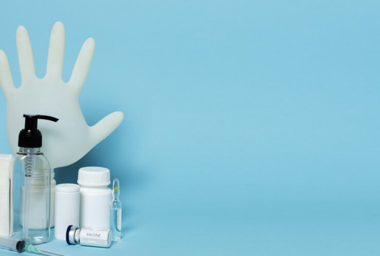 Assorted best dermatological products arranged on a blue background.